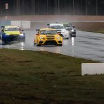 Race cars in the rain